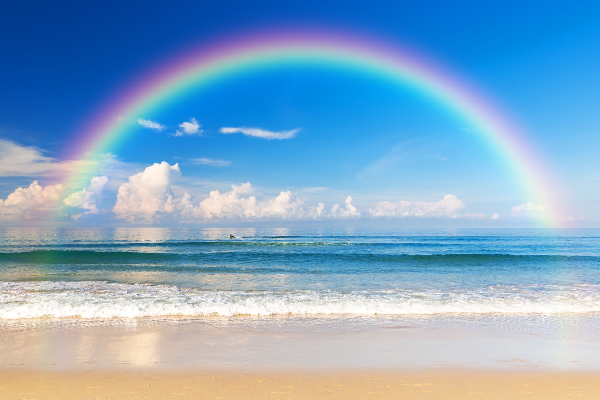 Beautiful sea with a rainbow in the sky